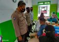 Polsek Baamang Pengamanan Pelaksanaan Vaksinasi di Puskesmas Baamang II